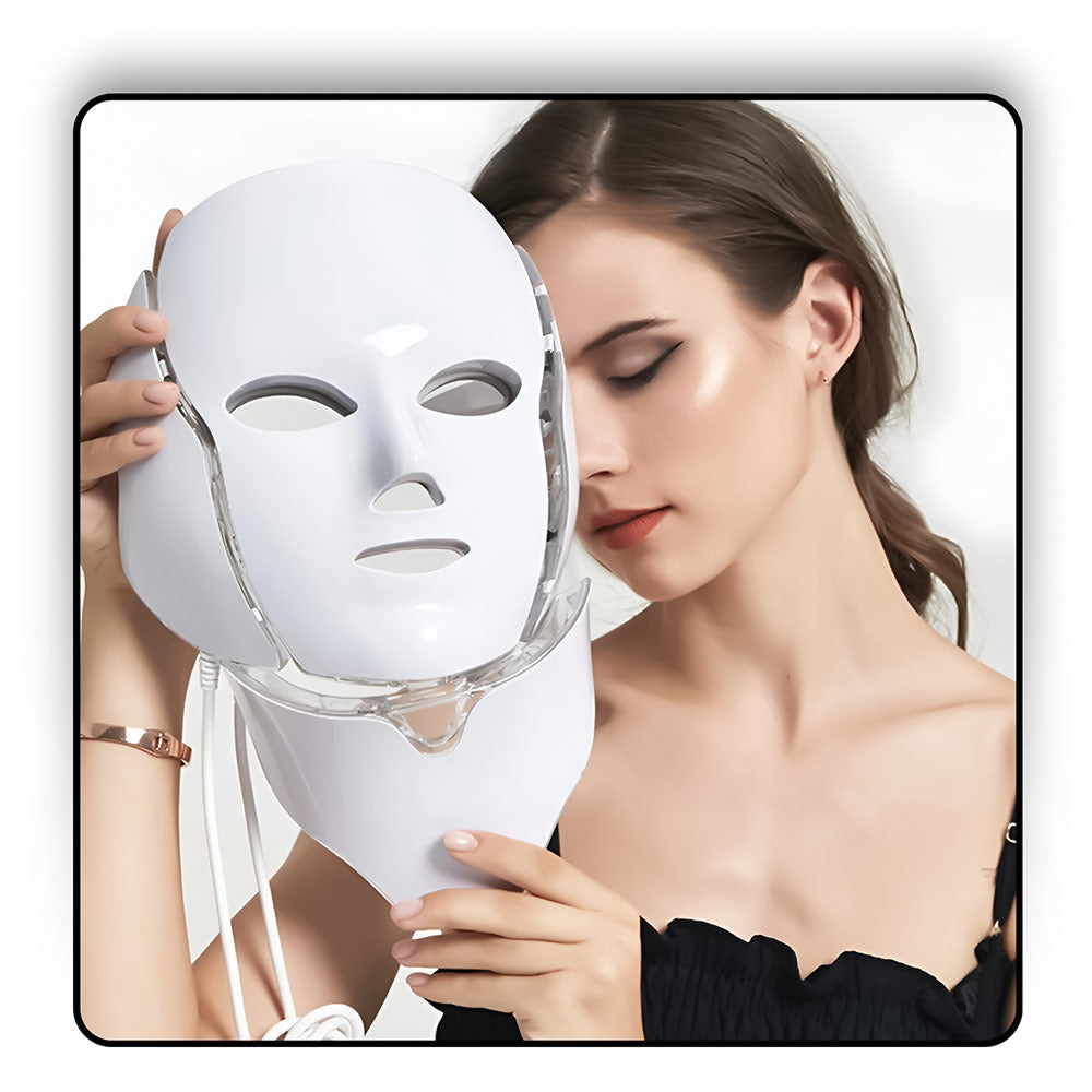 Woman holding LED Light Therapy Face Mask, ready to start her skincare routine