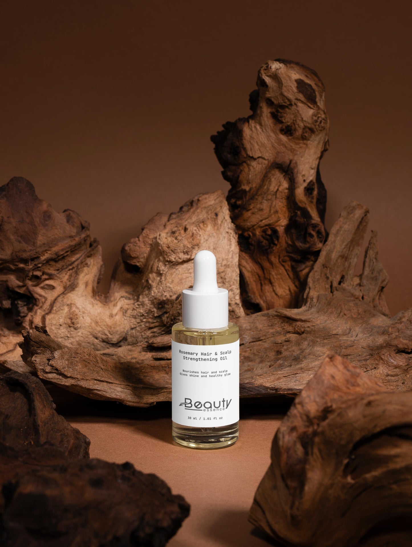 Skincare dropper bottle with a label on a brown background with natural wood elements