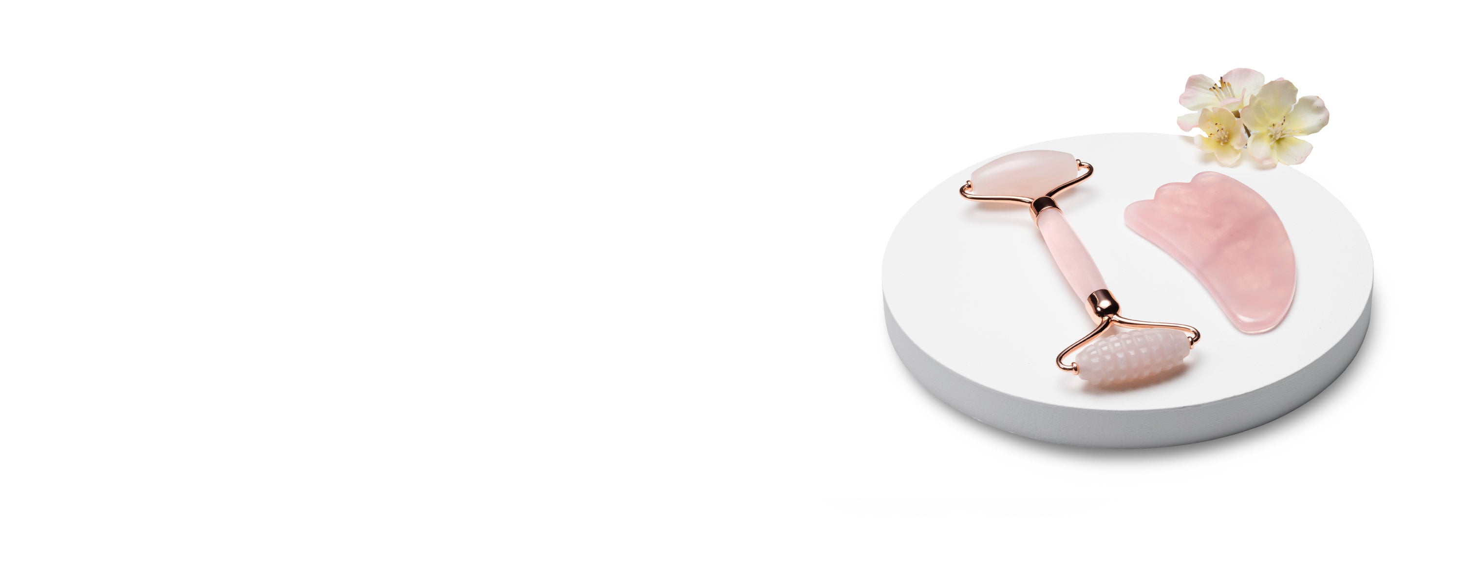 Cheap beauty products UK displayed with skincare and makeup tools on white background.