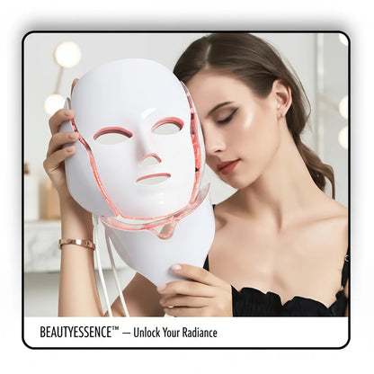 Woman holding a white led light therapy mask​ with visible branding on a blurred indoor background