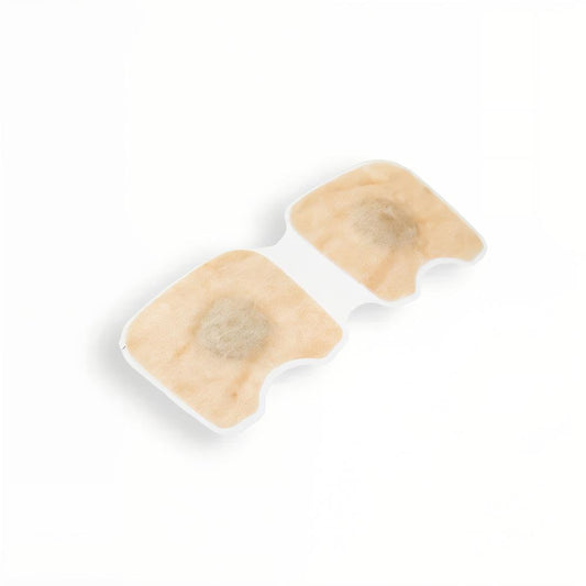Man sleeping peacefully using magnetic nasal strips to improve breathing and reduce snoring for a restful night’s sleep.
