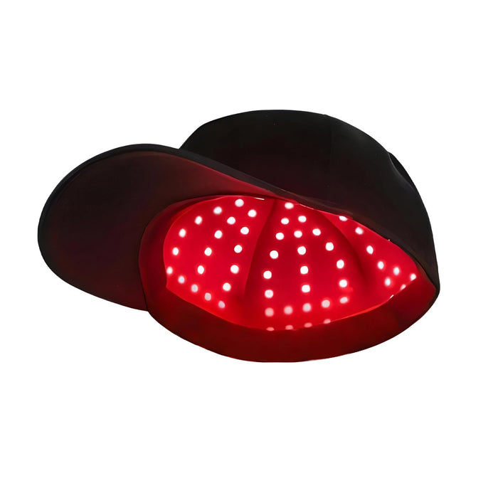 Red light scalp care cap with LEDs switched on