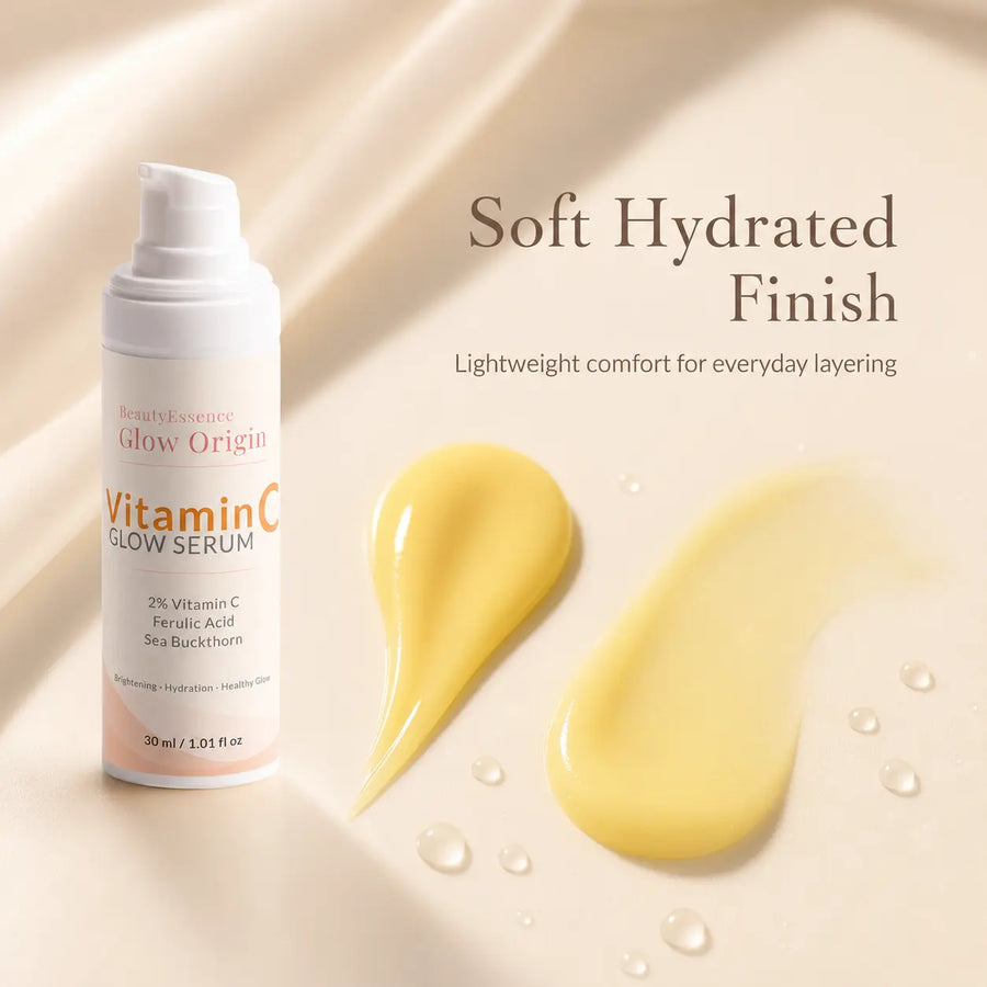 BeautyEssence Vitamin C Glow Serum bottle with serum droplets on a beige background