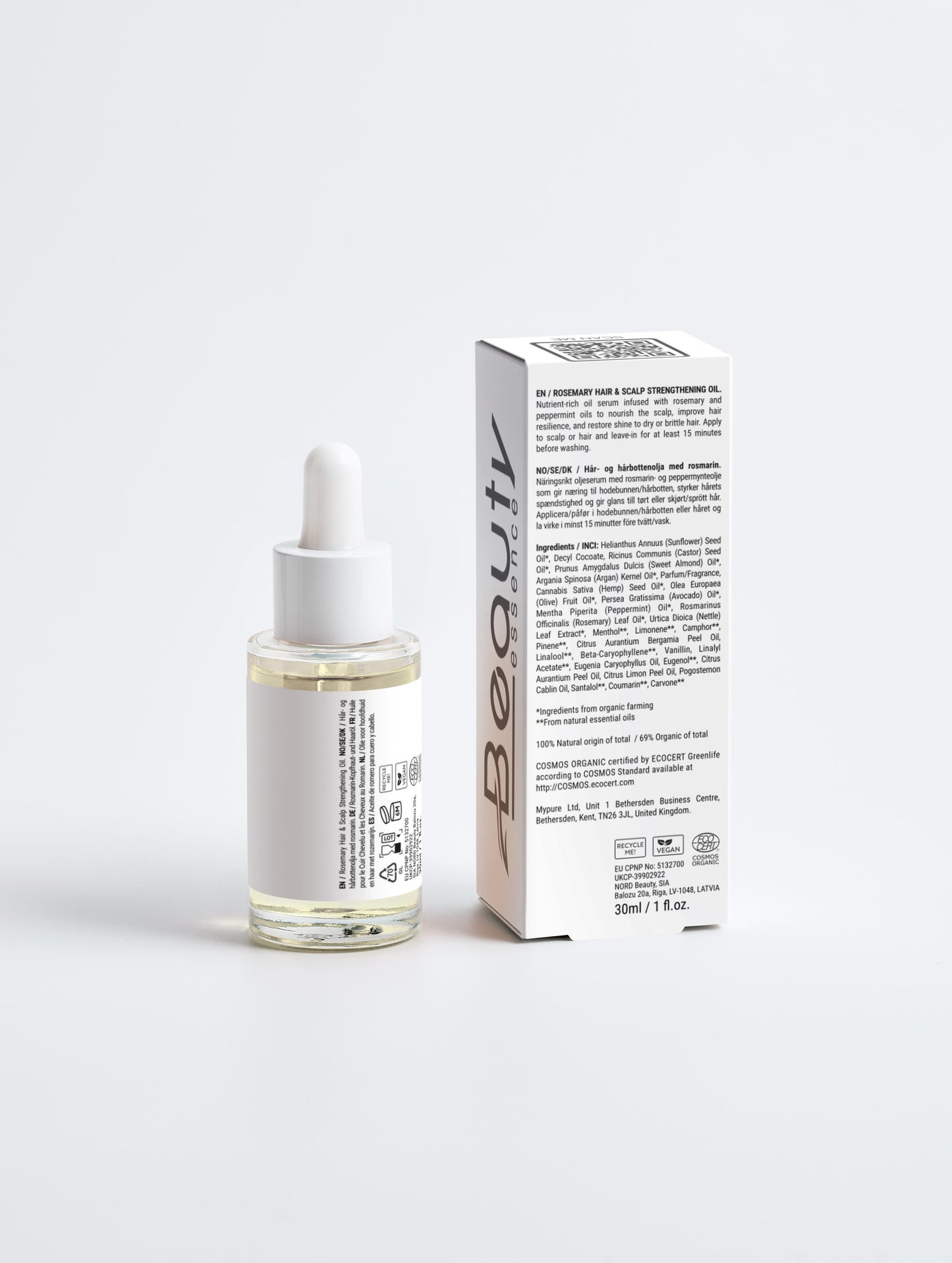 Skincare serum bottle with dropper and its packaging on a white background