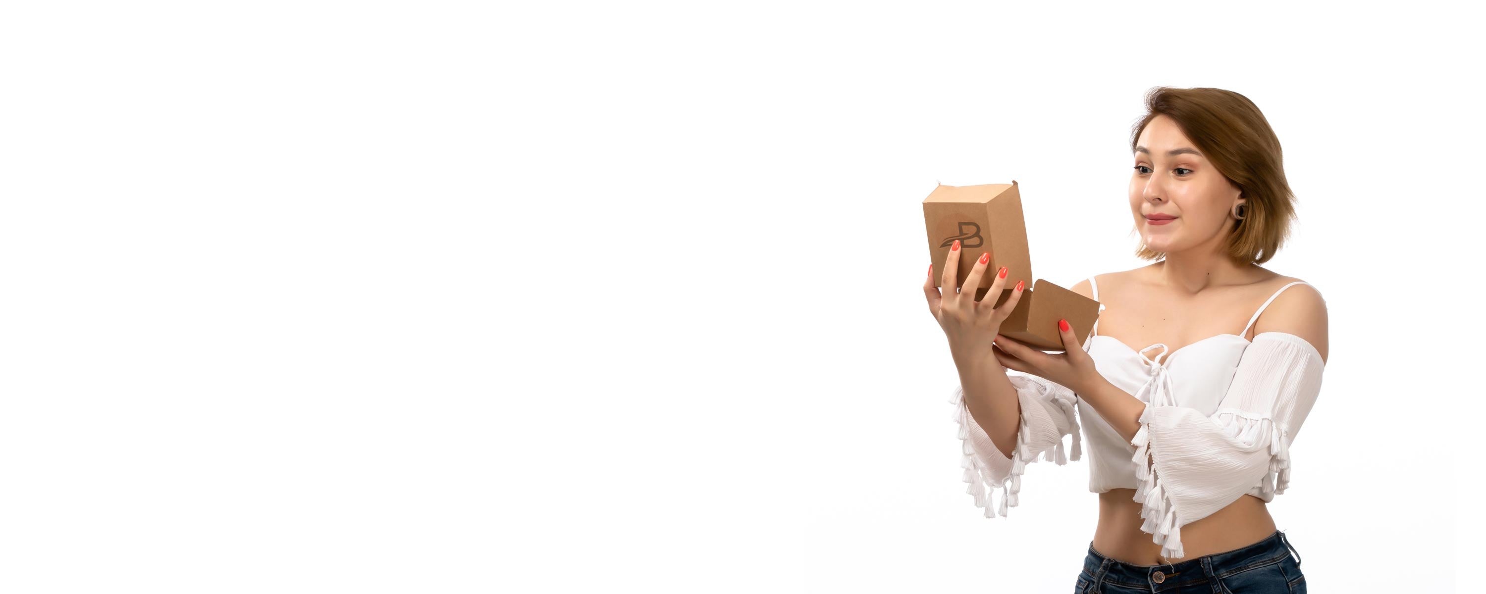 Smiling woman with BeautyEssence parcel showcasing easy Returns process and customer care.